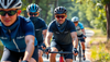A group of cyclists wearing neck gaiter on way