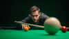 A billiards player executing an advanced cue ball spin