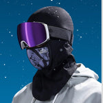 Movagear winter balaclava with magnetic mask in black worn with ski goggles under falling snow